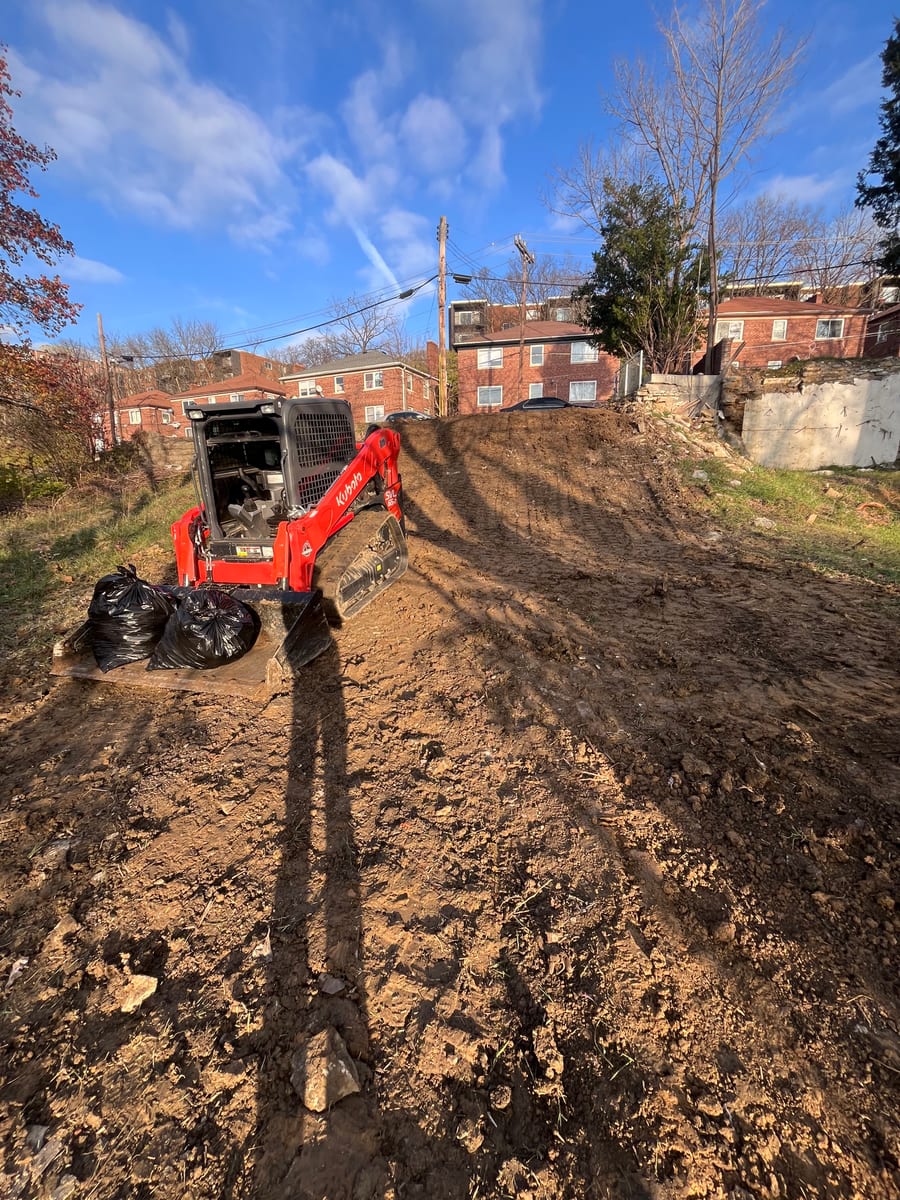 Kubota excavator on a job site — Merten Land Clearing & Excavation