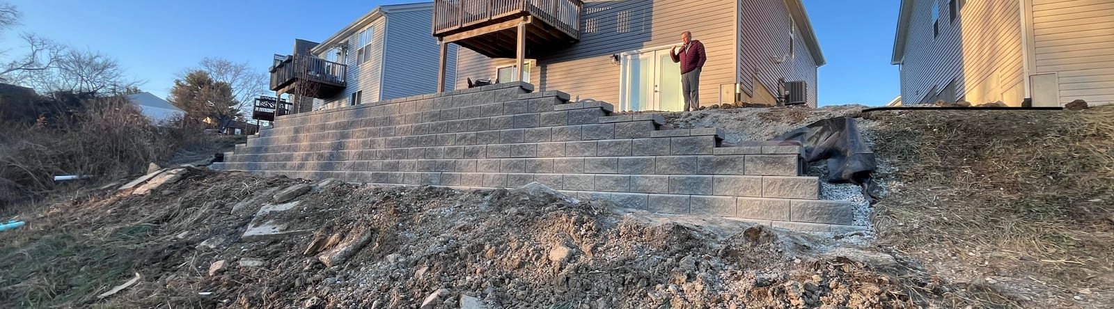 Finished modular block retaining wall with steps