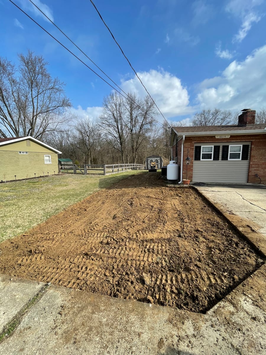 Grading work in progress — finish grading for drainage and access